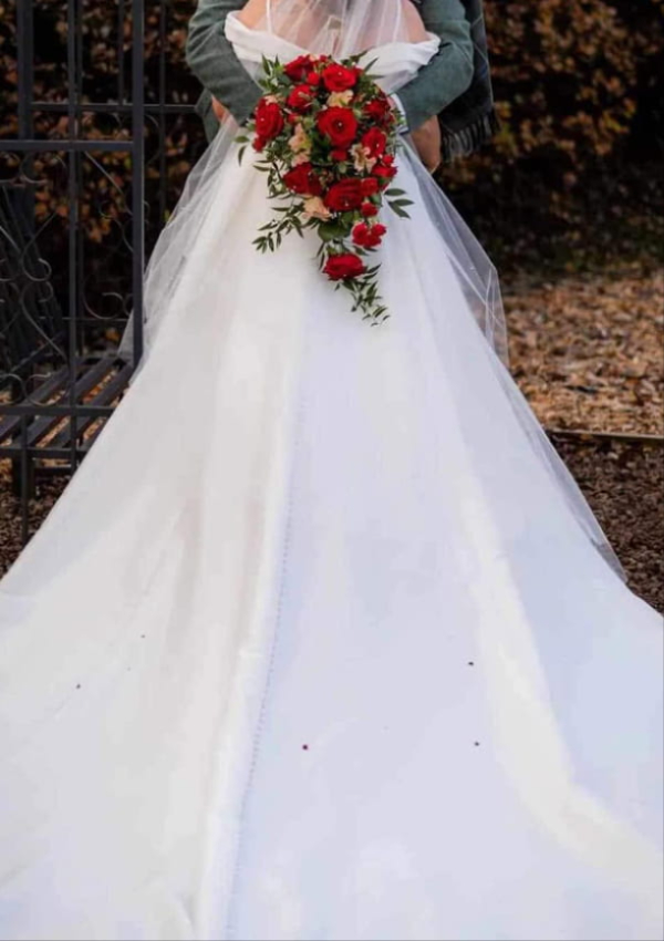 Bride holding a bespoke Thistle Du wedding bouquet