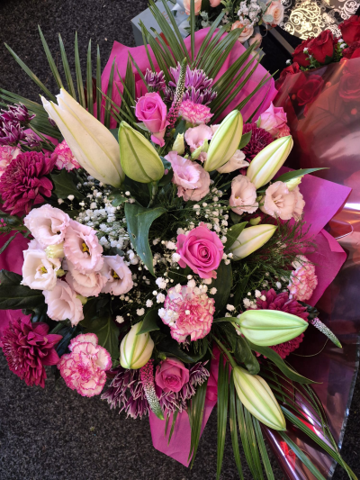 Pink Sensation - A luxurious bouquet in rich pink, plum and cream tones, perfect for making a statement.