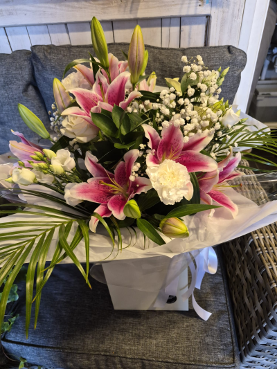 Stargazer - An impressive bouquet in striking pink and white shades, beautifully arranged with lush greenery.