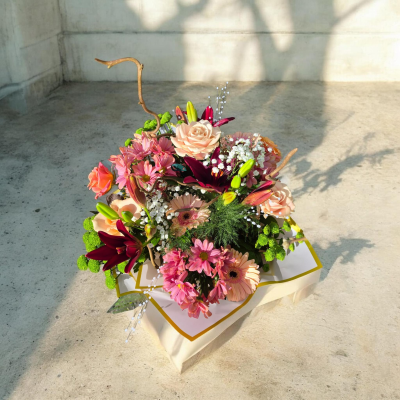 Pretty in Pink - A beautiful bouquet in soft pink, peach and rich berry tones.