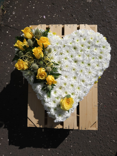 Sunshine Heart Tribute - A beautiful white heart finished with uplifting yellow accents to celebrate a treasured life.