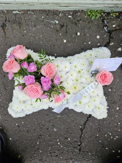 Cushion Tribute - A traditional cushion tribute in white and pink, lovingly created in memory of a treasured sister.