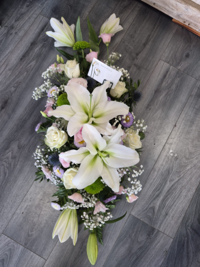 Peaceful Farewell Casket Spray - A graceful casket spray in soft white and pale pink tones, created with care and sensitivity.
