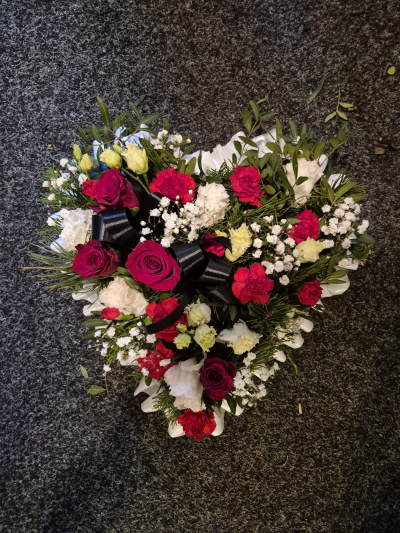 Deepest Love Heart - A striking heart-shaped tribute finished with ribbon detailing.